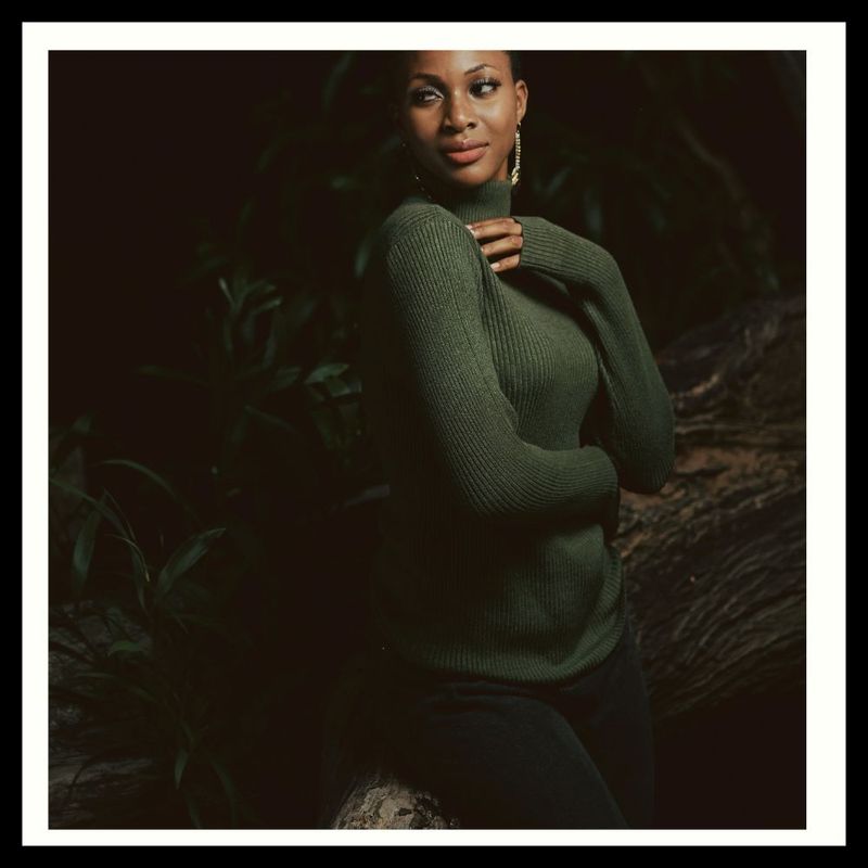 Woman in green turtleneck 