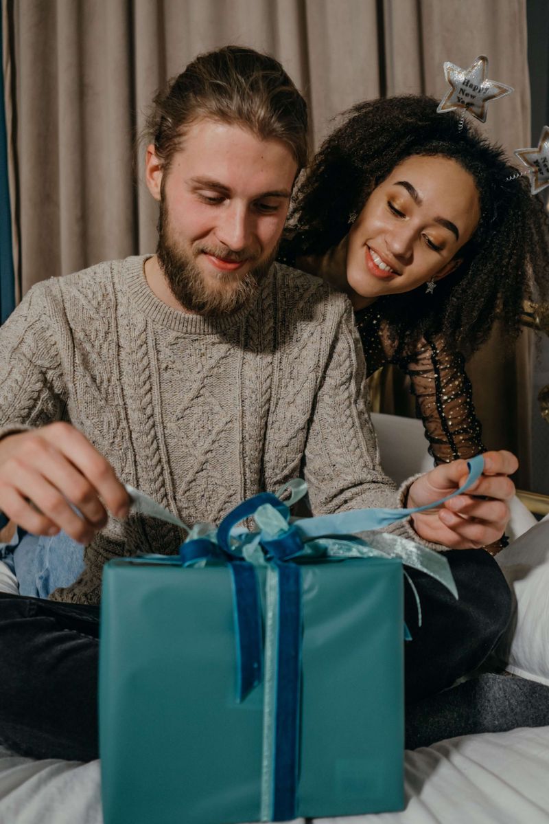 Man opening wrapped gift with woman